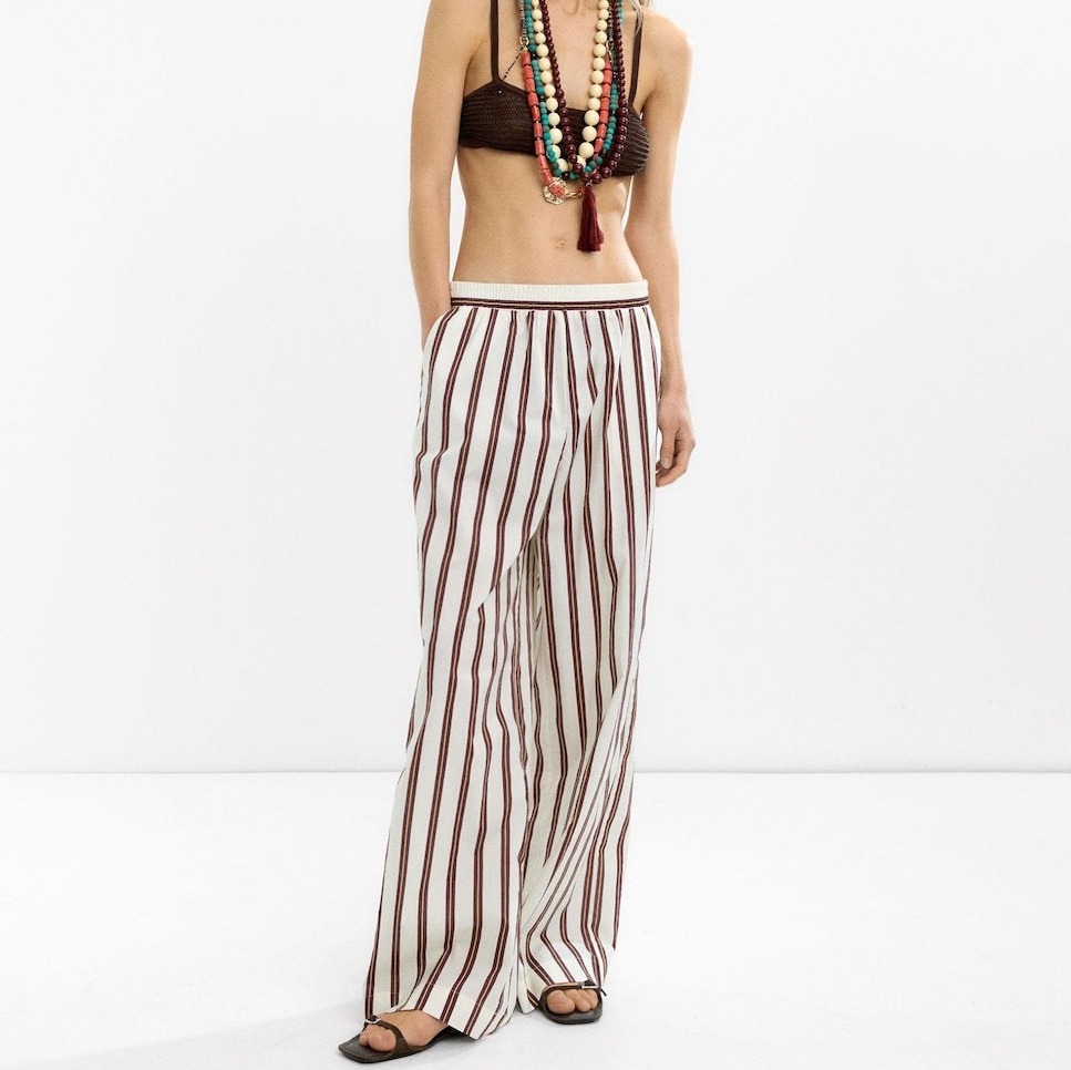 
Parfois
Pantalón fluido de mujer 100% algodón con cintura elástica y estampado de rayas