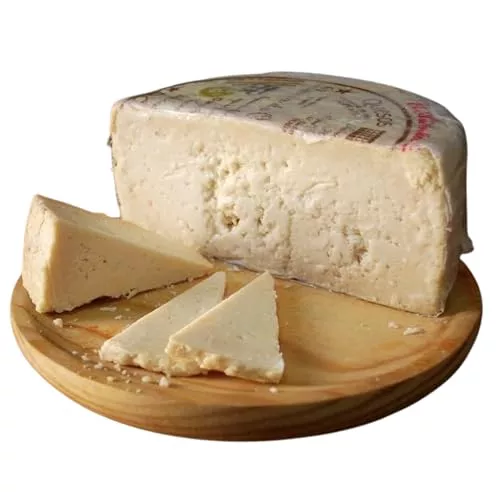 1/2 QUESO ROMERO OCAÑA para paladares exquisitos, graso, mantecoso, con pique, granuloso y quebradizo, color ocre, debido a su larga maduración de hasta 2 años