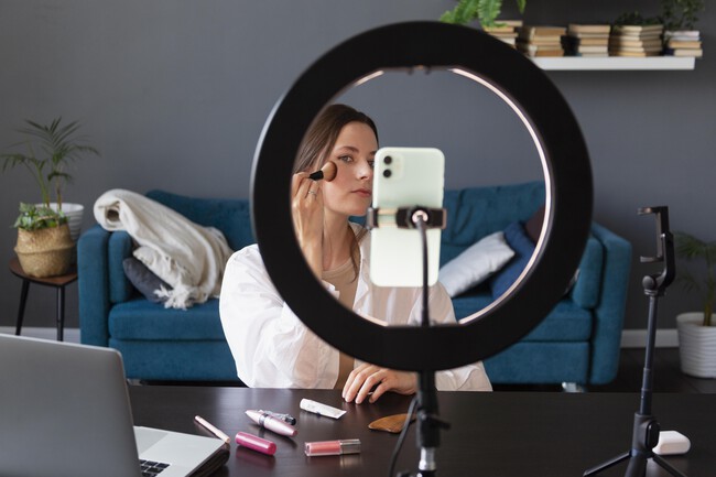 Woman Making Makeup Vlog With Her Smartphone