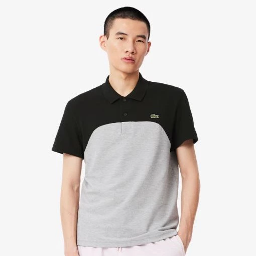 Lacoste - Polo de hombre  de corte regular con bloques de color.