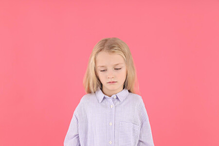 Resentful Little Girl In Shirt On Pink Background